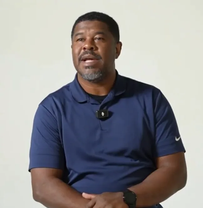 Brian Clincy, in a navy polo, speaking during a Building Our Tech video interview