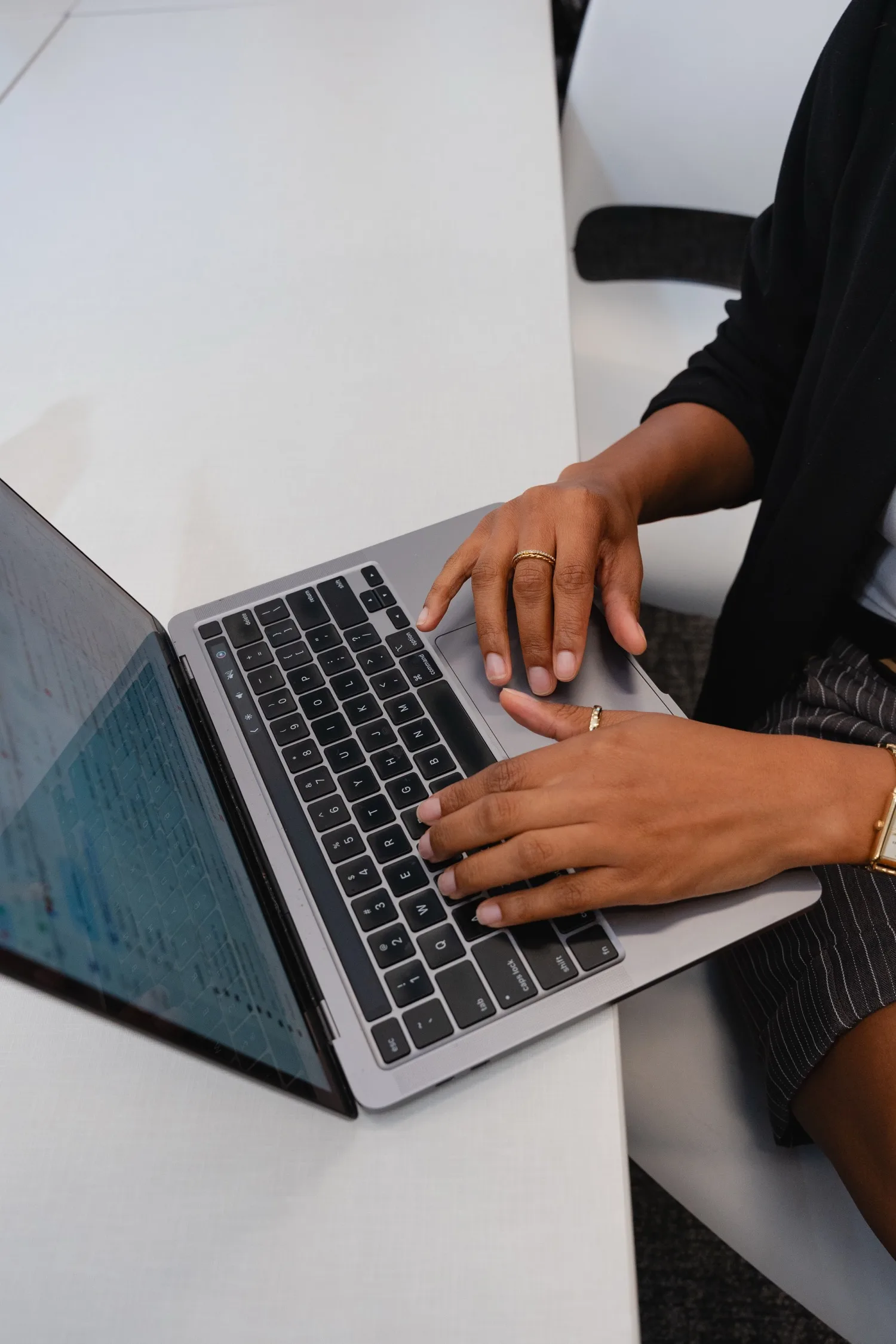 A participant typing on a laptop during a Building Our Tech session
