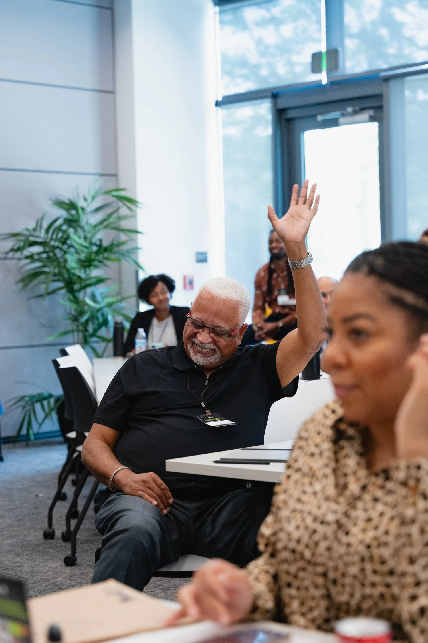A participant raising their hand during a session at Building Our Tech&rsquo;s ScaleUp conference