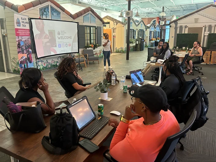 Attendees at laptops following along during a Swift and SwiftUI workshop at Credo Conduit